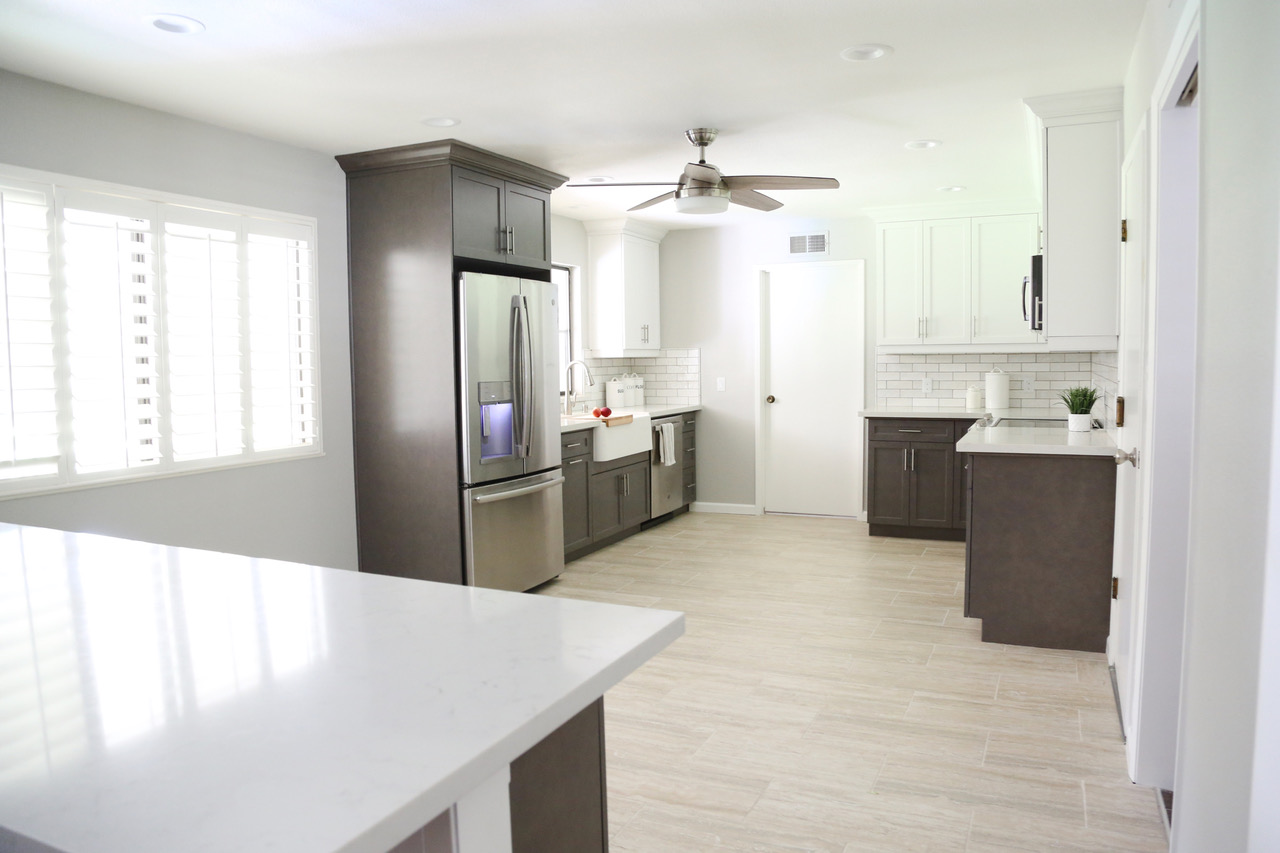 a wide angle of a white marble kitchen countertop