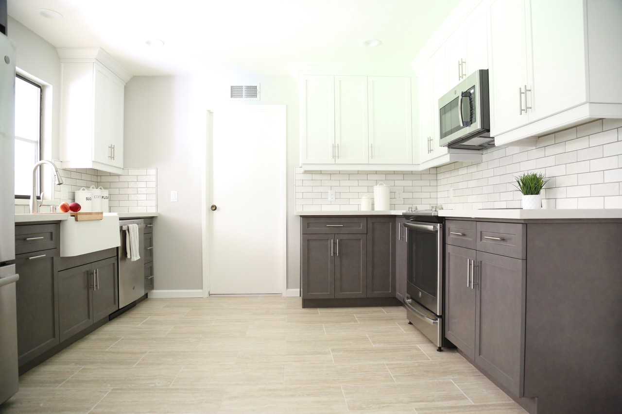 a white tile splashback in a kitchen